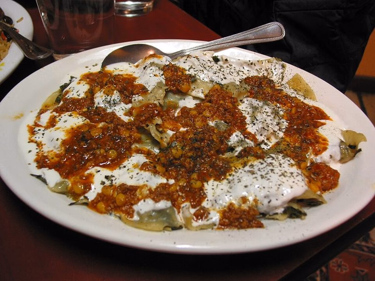 Afghan ashak with yoghurt and meat sauce
