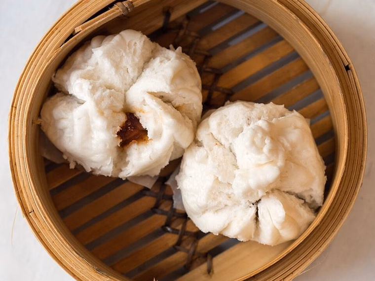 Steamed char siu bao buns split open